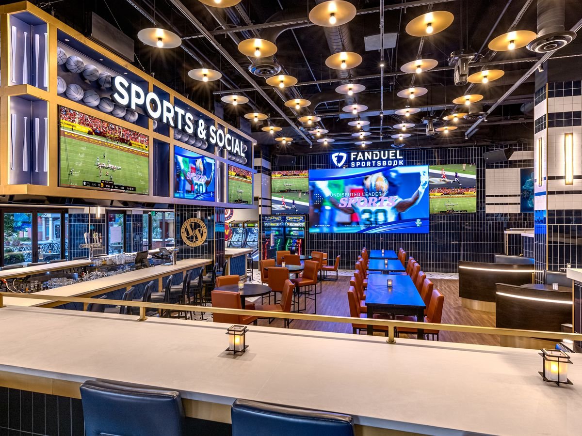 Interior of the new sports bar and grill, showcasing a lively atmosphere and sports-themed decor